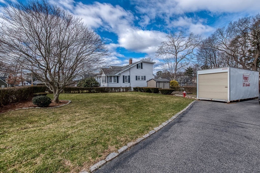 409 Mt Vernon Street Dedham, MA 02026 - Photo 37 of 42 a view of a house with a yard