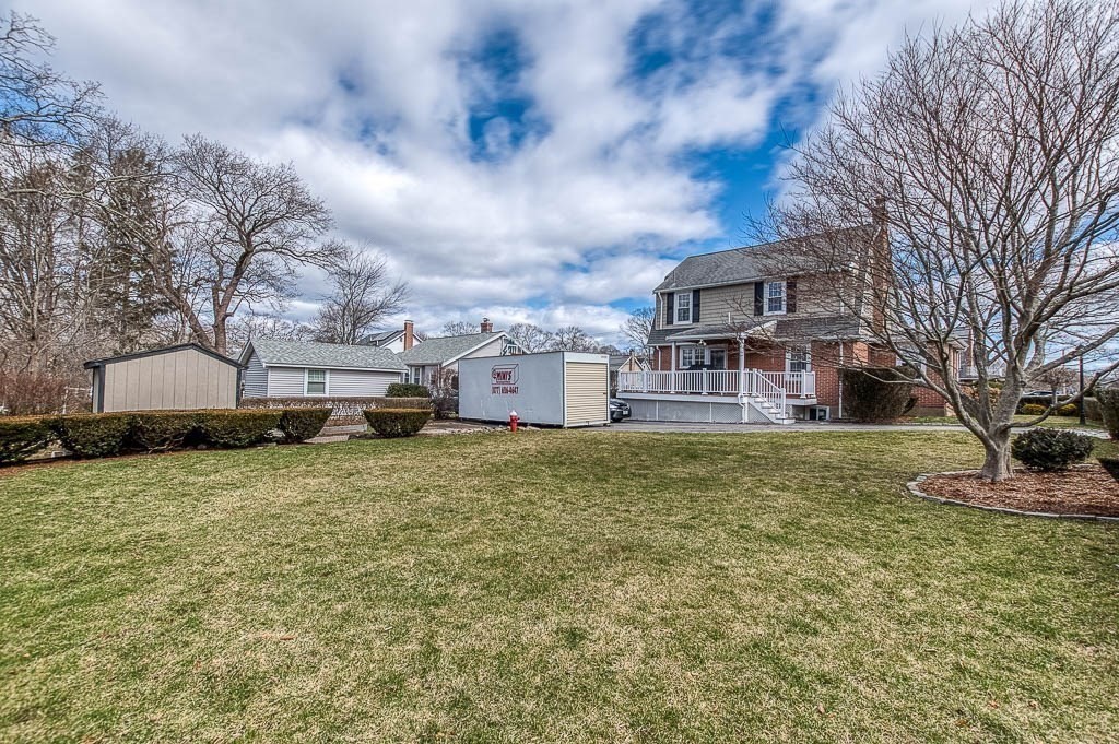409 Mt Vernon Street Dedham, MA 02026 - Photo 38 of 42 a front view of a house with a yard