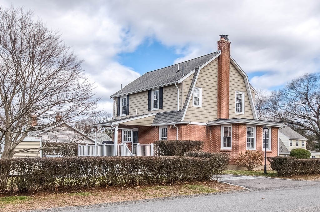 409 Mt Vernon Street Dedham, MA 02026 - Photo 4 of 42 a front view of a house with a garden