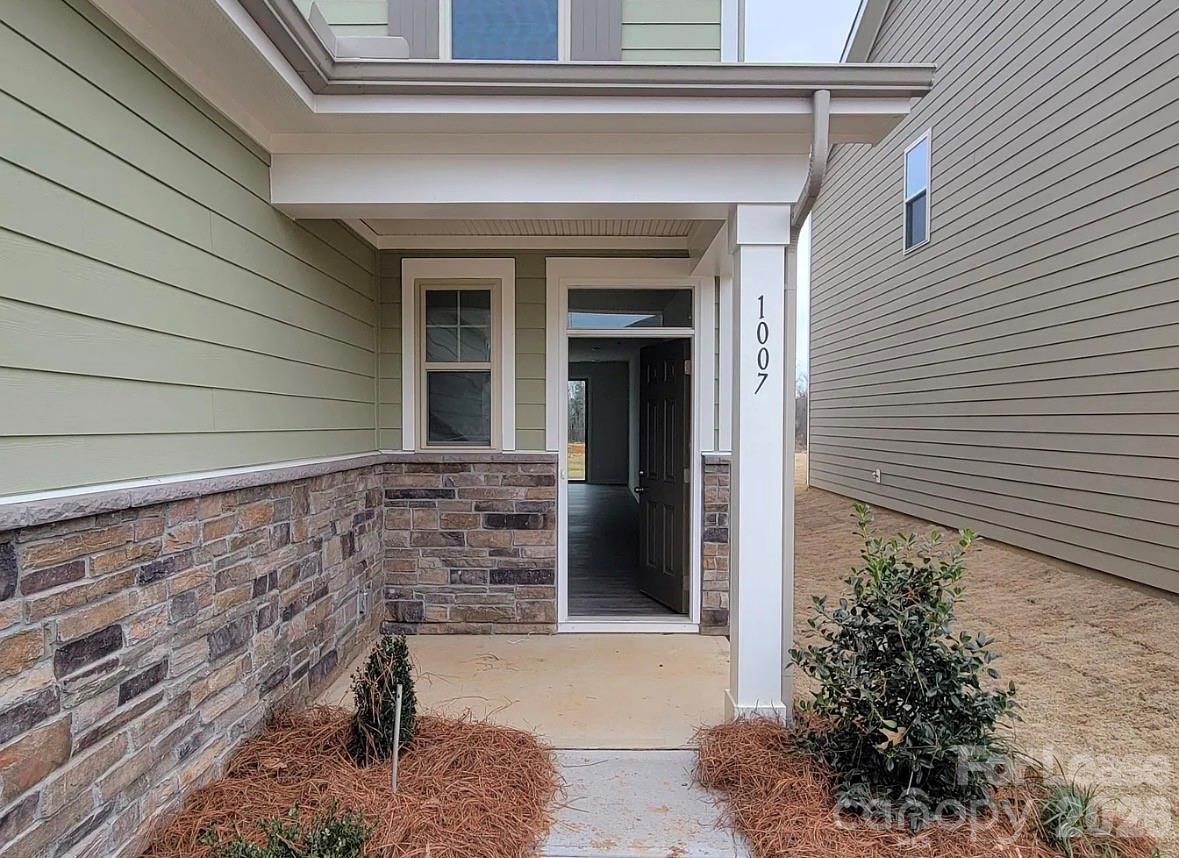1007 Maylen Trace Monroe, NC 28110 - Photo 2 of 34 a front view of a house with a yard
