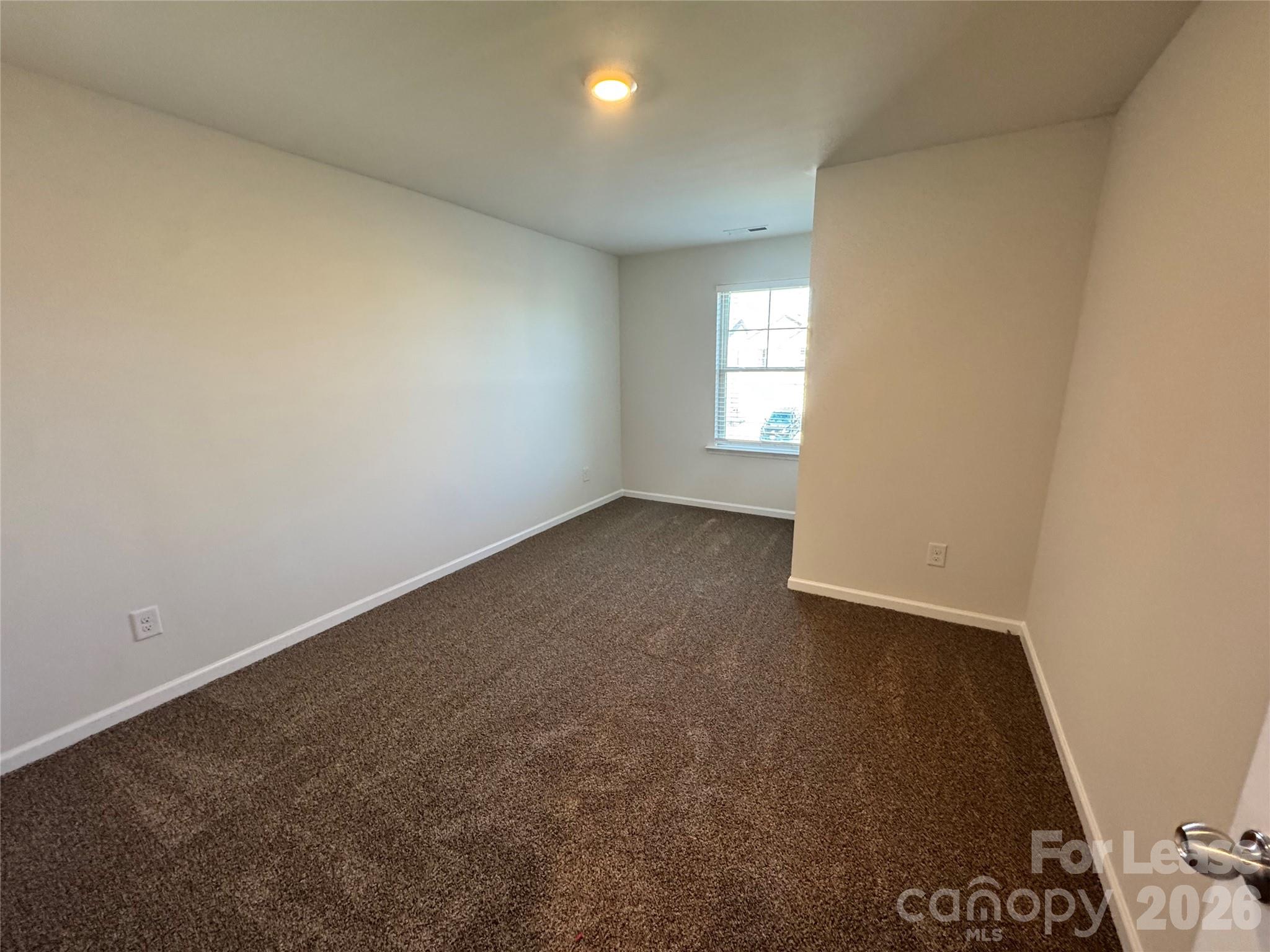 1007 Maylen Trace Monroe, NC 28110 - Photo 21 of 34 an empty room with a window