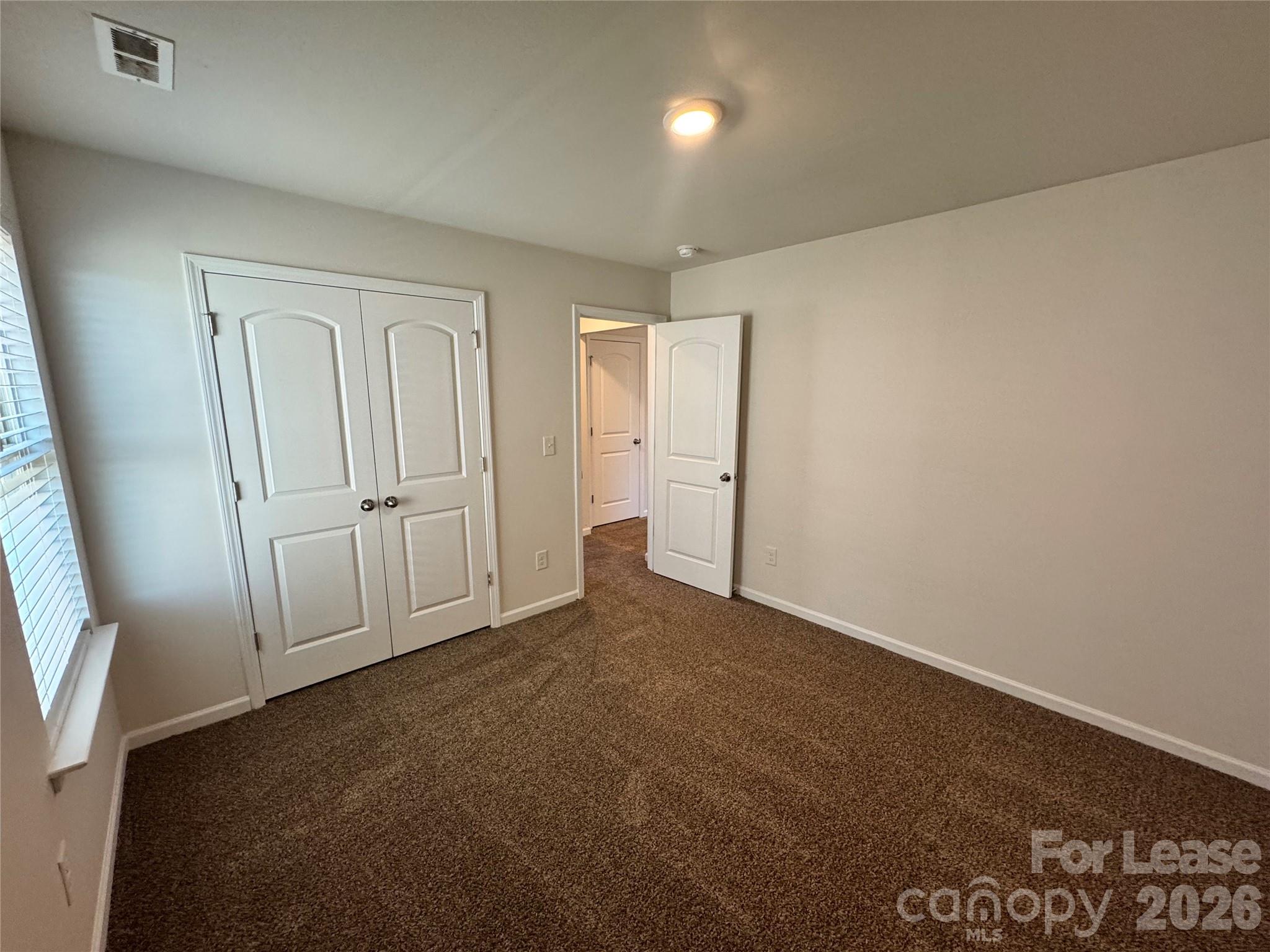 1007 Maylen Trace Monroe, NC 28110 - Photo 25 of 34 an empty room with windows