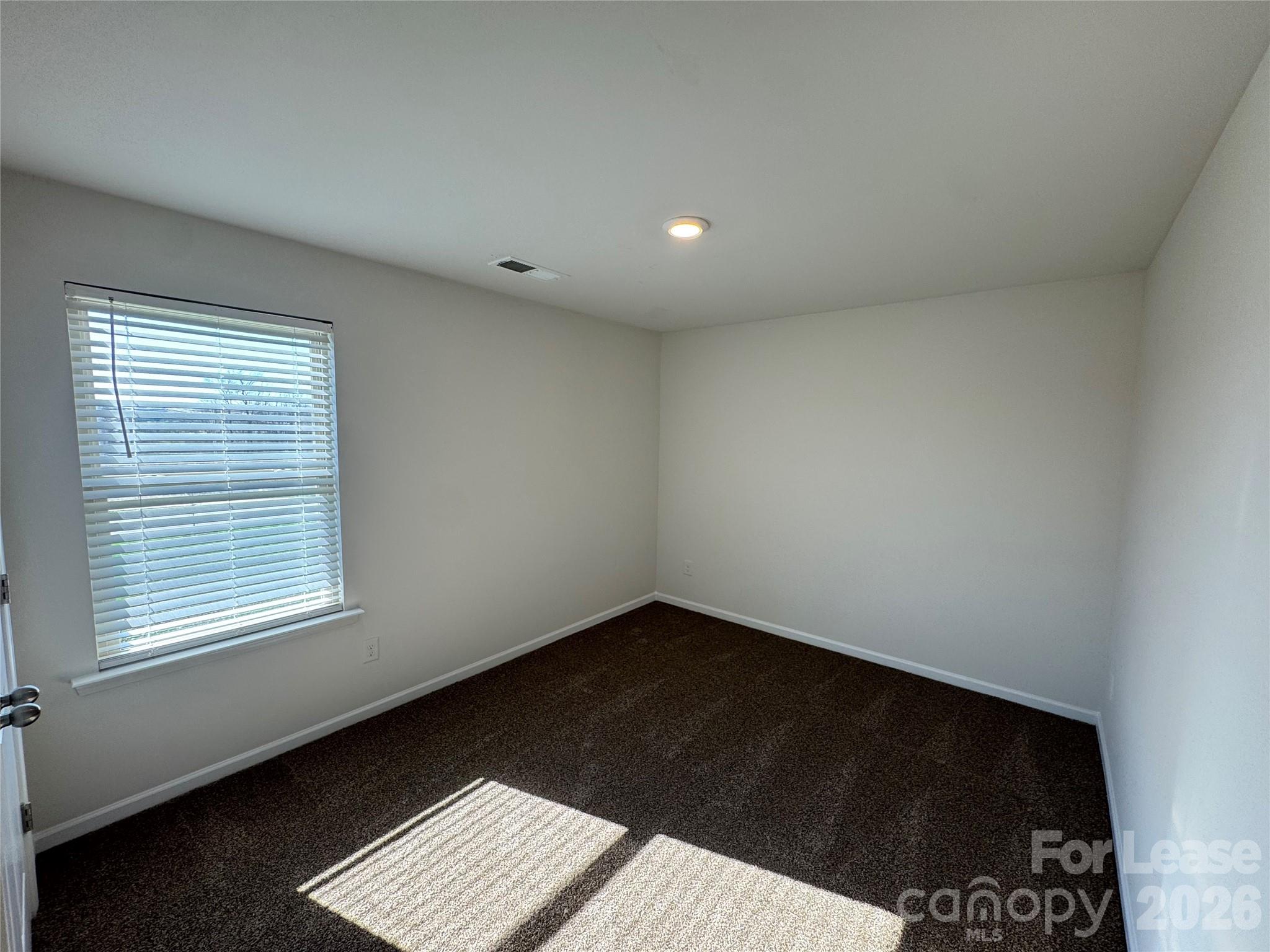 1007 Maylen Trace Monroe, NC 28110 - Photo 28 of 34 a view of an empty room and a window