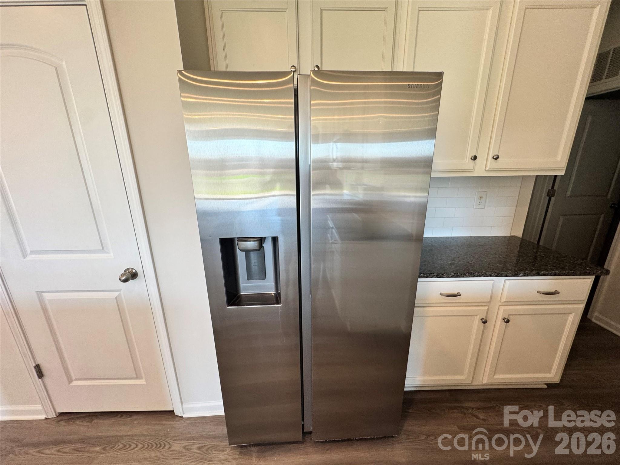 1007 Maylen Trace Monroe, NC 28110 - Photo 5 of 34 a bathroom with a refrigerator and a sink