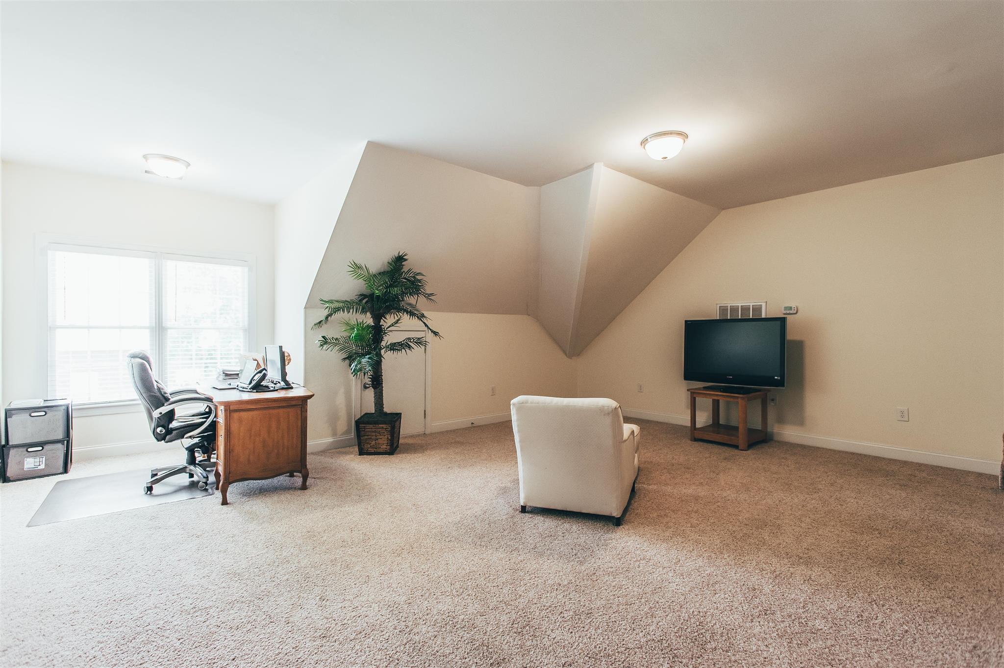 241 Ridgewater Way Mount Juliet, TN 37122 - Photo 14 of 22 a living room with furniture and a flat screen tv