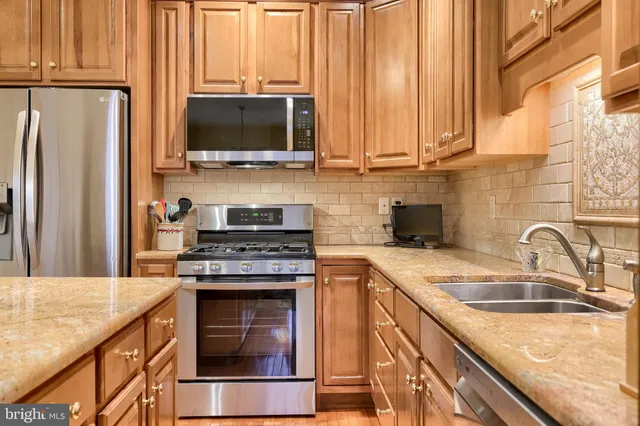 a view of a dining room with furniture and a chandelier