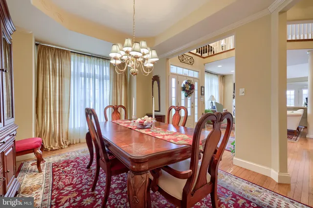 a spacious bathroom with a granite countertop sink a mirror and a