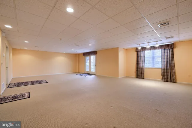a view of entryway livingroom and hall with wooden floor