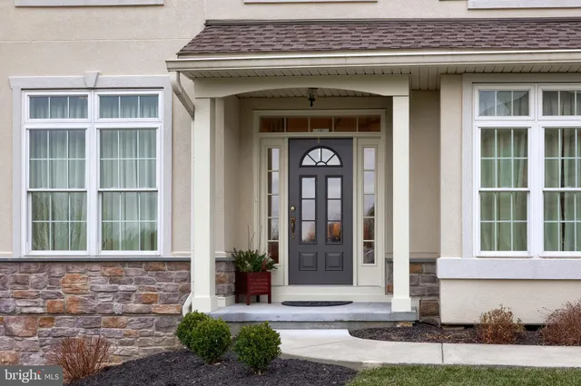 a kitchen that has a table and chairs in it
