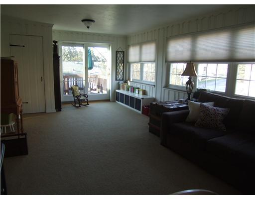 2035 Mohawk Road Upper St. Clair, PA 15241 - Photo 3 of 13 Family Room. This view of the family room displays the vast size and the great views of the side and rear yard. Notice the sliding glass doors to the rear deck.