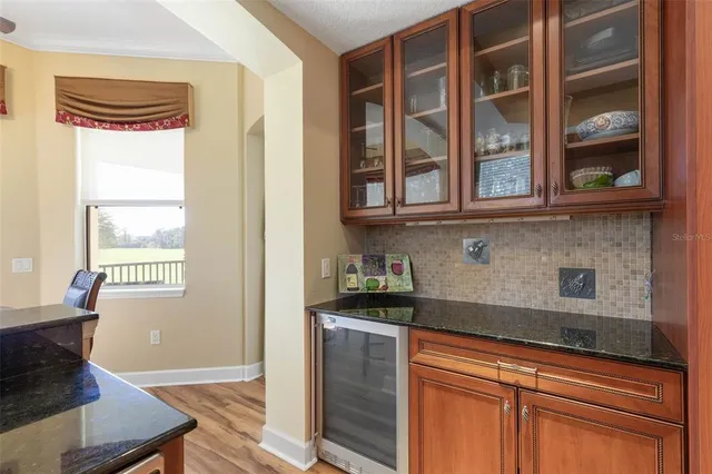 a view of a park with bench and trees