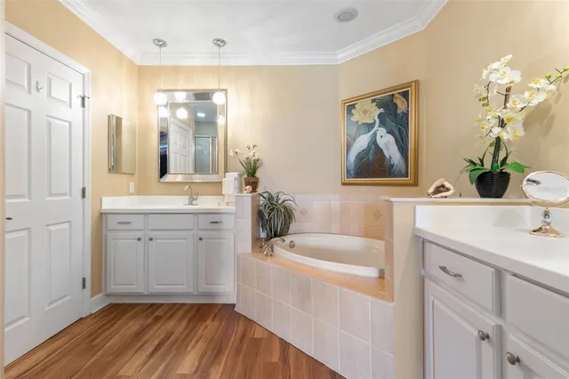 an aerial view of a house with a garden and lake view