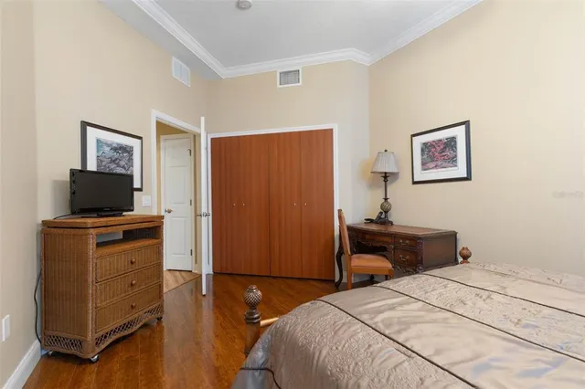 an aerial view of a house with a garden and lake view