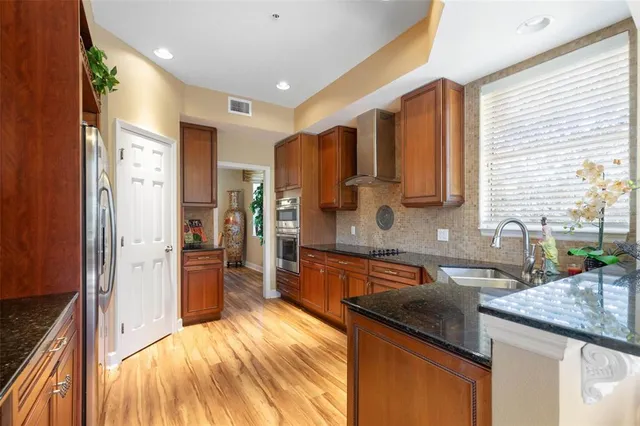 a bathroom with a sink toilet a mirror and shower