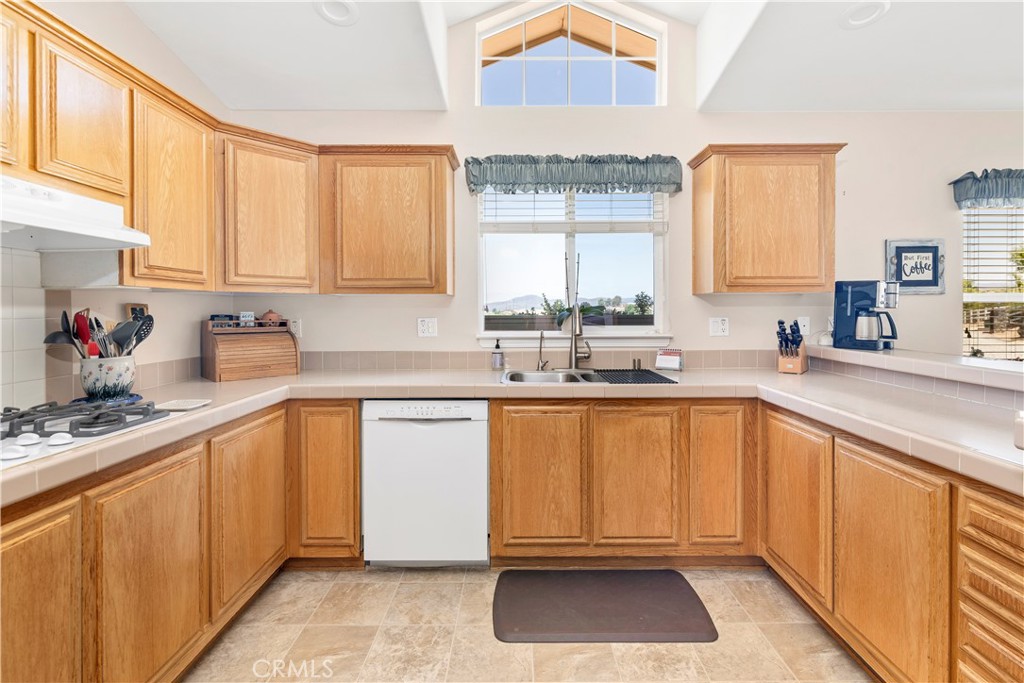 39597 Calle Escalona Temecula, CA 92592 - Photo 17 of 61 a kitchen with a sink cabinets and window