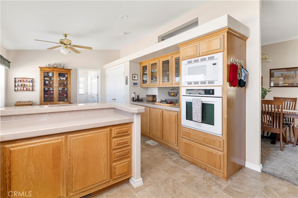 39597 Calle Escalona Temecula, CA 92592 - Photo 19 of 61 a kitchen with cabinets and window