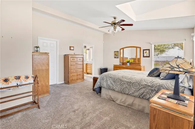 a bathroom with a tub a sink and a large mirror