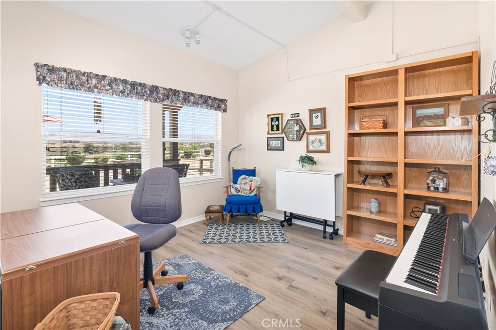 39597 Calle Escalona Temecula, CA 92592 - Photo 28 of 61 a living room with furniture a rug and a large window