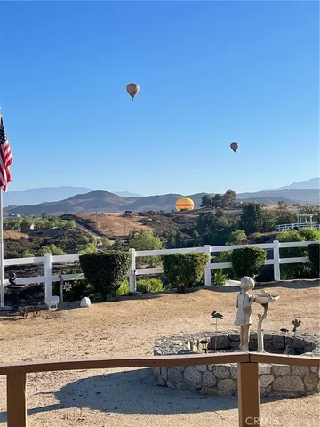 a view of a terrace with wooden fence