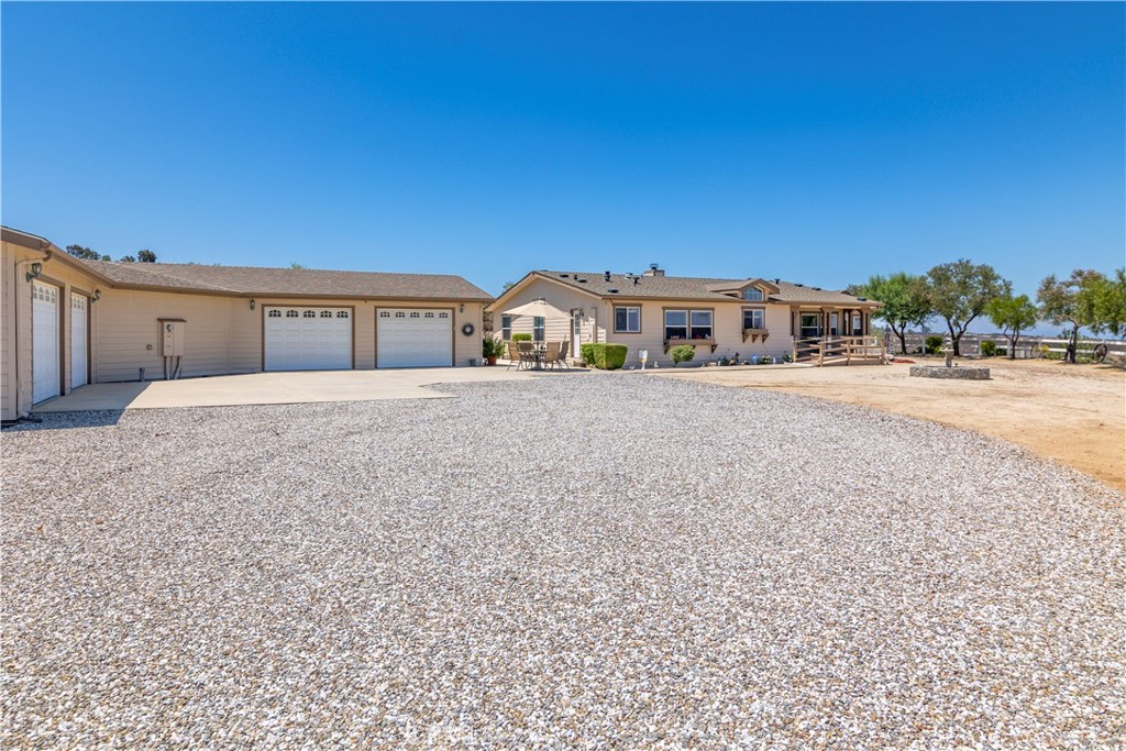 39597 Calle Escalona Temecula, CA 92592 - Photo 6 of 61 a large house with a big yard and large trees