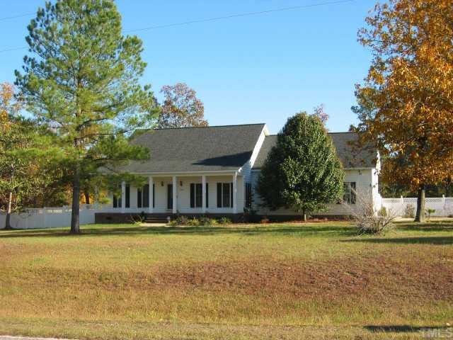 760 Mitchell Road Angier, NC 27501 - Photo 1 of 12 a front view of house with yard and trees