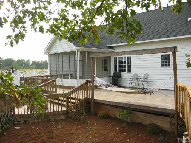 760 Mitchell Road Angier, NC 27501 - Photo 7 of 12 a view of a house with backyard and sitting area