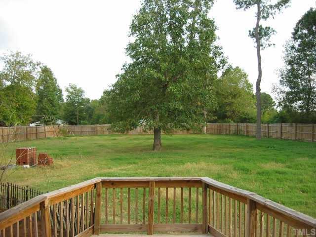 760 Mitchell Road Angier, NC 27501 - Photo 8 of 12 a view of a wooden deck and a yard with swimming pool