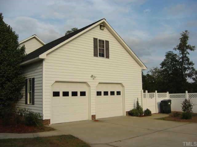 760 Mitchell Road Angier, NC 27501 - Photo 9 of 12 a view of a white house with a yard