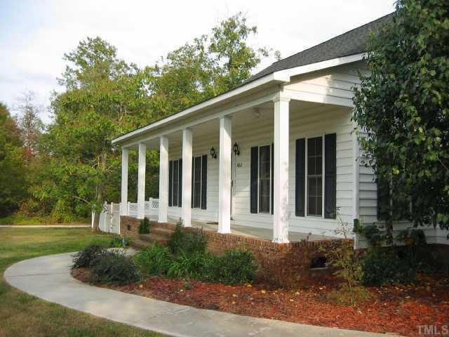 760 Mitchell Road Angier, NC 27501 - Photo 10 of 12 a front view of a house with garden