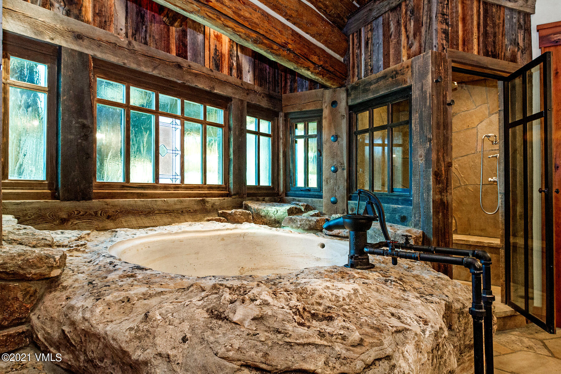 2291 Daybreak Ridge Road Avon, CO 81620 - Photo 29 of 56 a view of a brick house with many windows