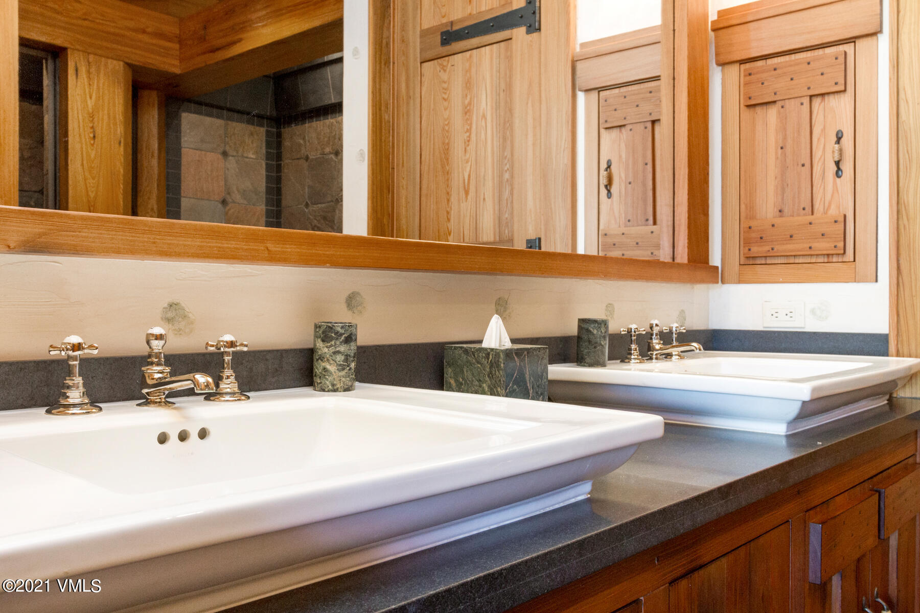 2291 Daybreak Ridge Road Avon, CO 81620 - Photo 41 of 56 a bathroom with a sink and a mirror