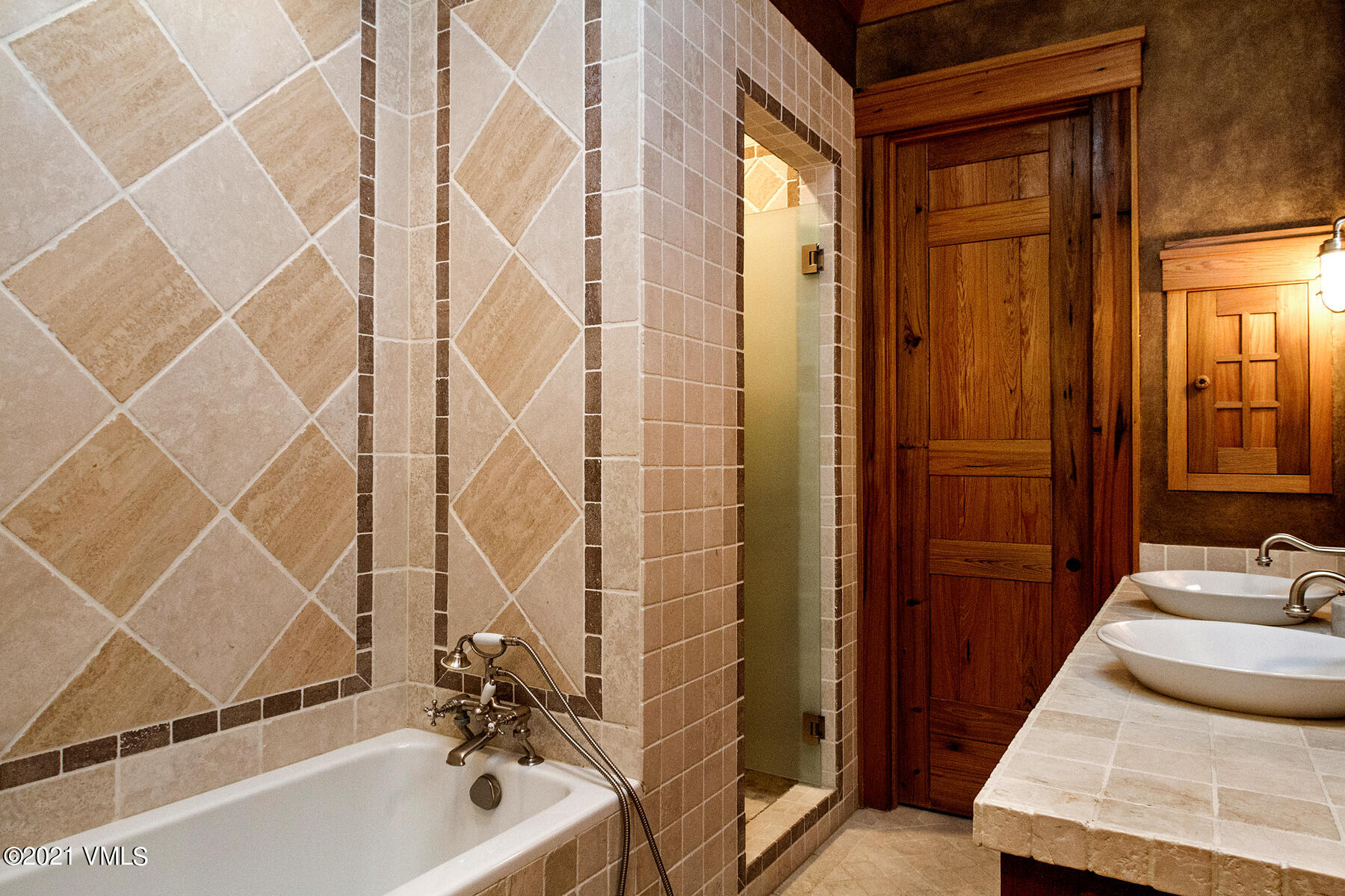 2291 Daybreak Ridge Road Avon, CO 81620 - Photo 44 of 56 a bathroom with a tub and shower