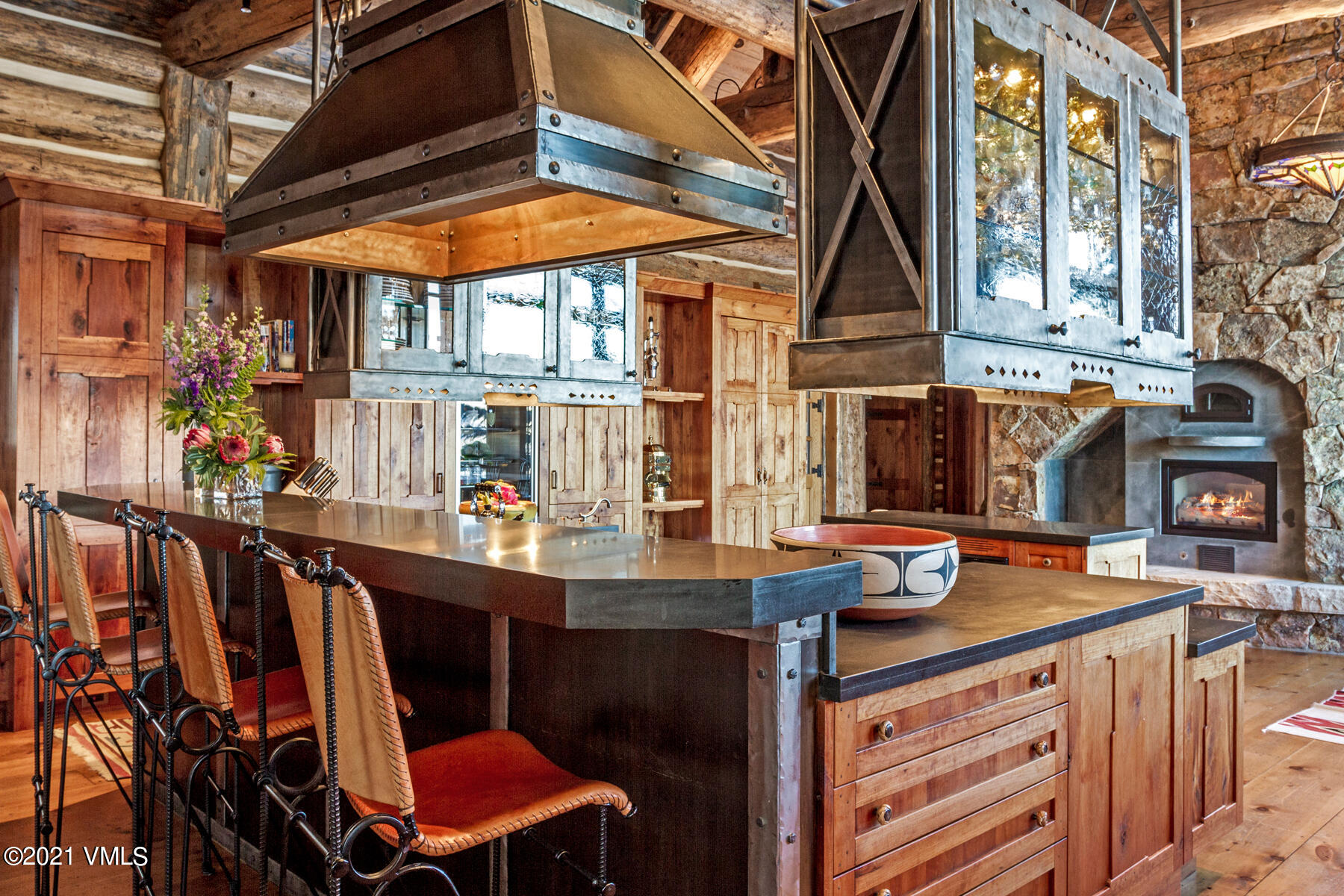 2291 Daybreak Ridge Road Avon, CO 81620 - Photo 9 of 56 a view of a chairs and table in a patio