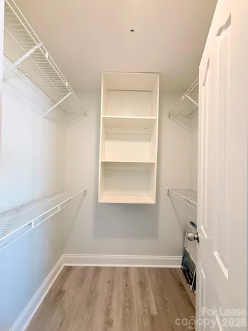 a view of an empty walk in closet