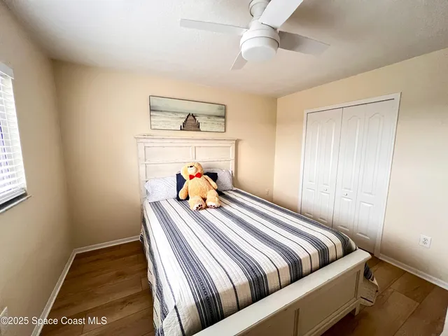 a bed room with a bed and a window