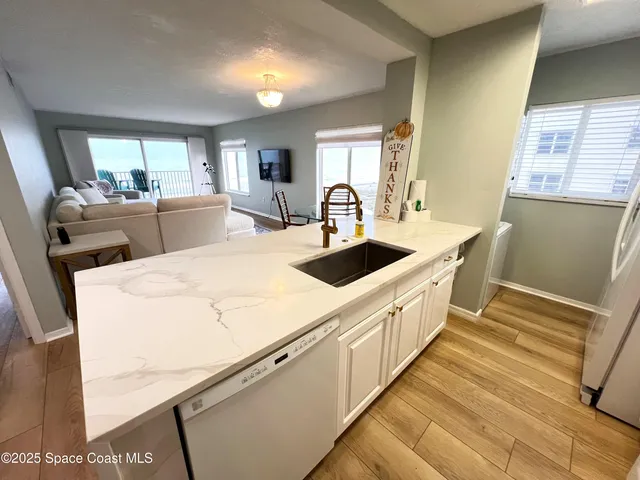 a open kitchen with stainless steel appliances granite countertop a lot of counter space and a window