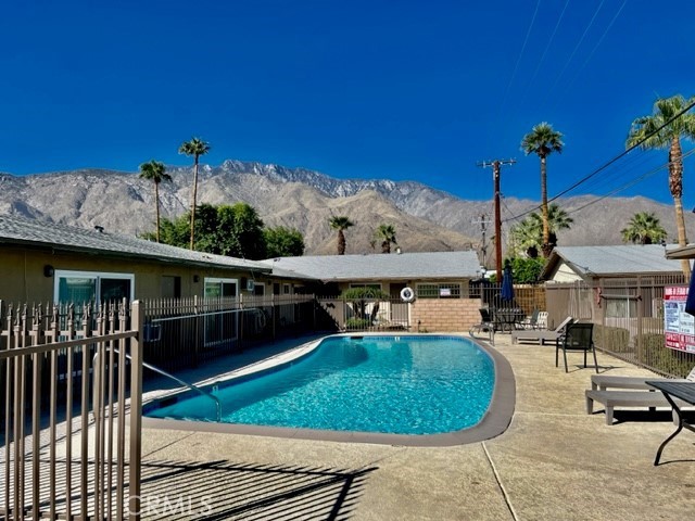 686 East Cottonwood Road, Unit 7 Palm Springs, CA 92262 - Photo 18 of 19 a view of a swimming pool with outdoor seating