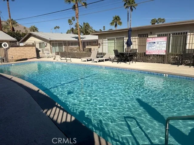 a view of a house with a backyard porch and sitting area