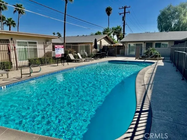 a view of a swimming pool with a patio