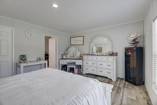 a bedroom with a bed and a dresser