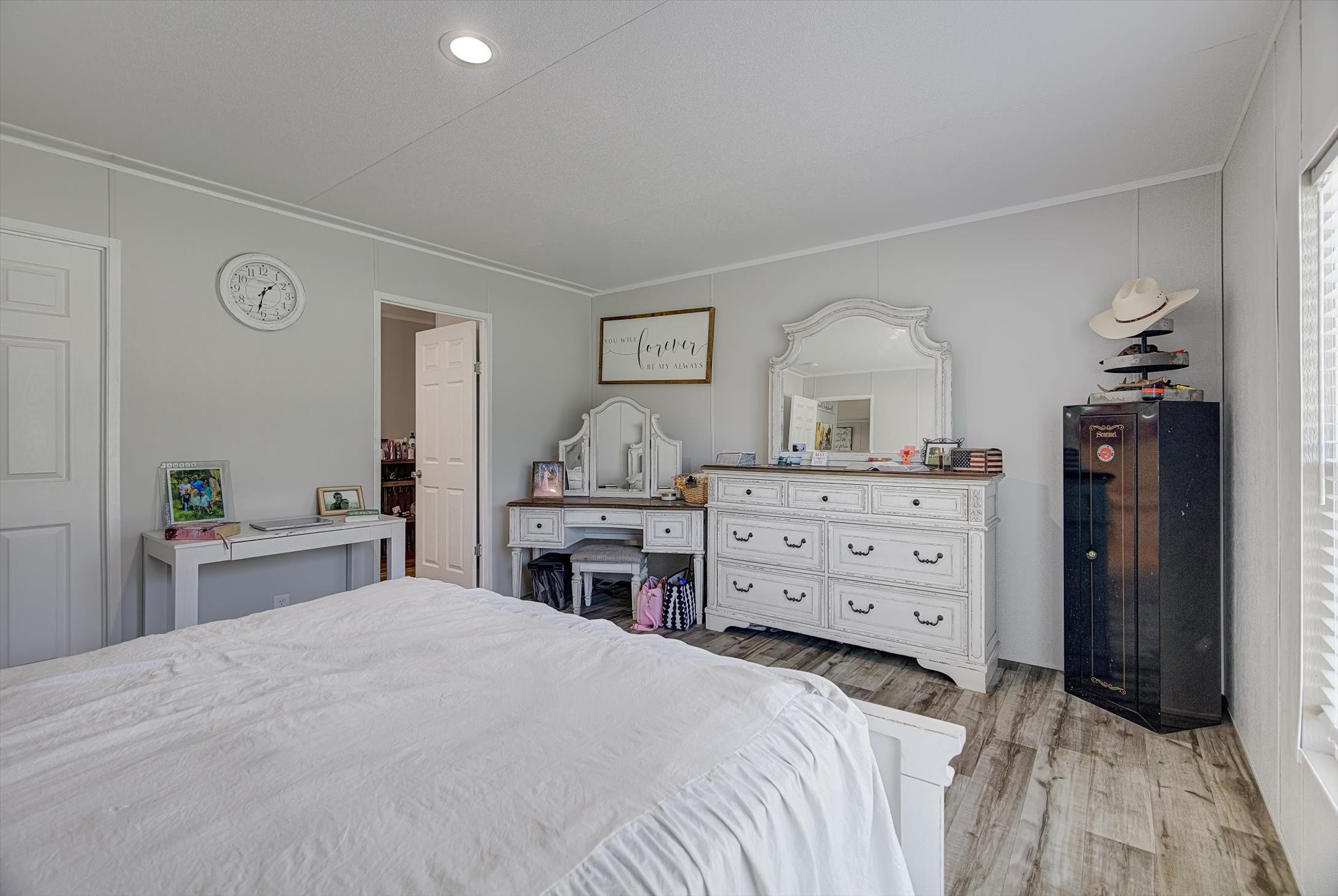 650 County Road 2219 Cleveland, TX 77327 - Photo 15 of 39 a bedroom with a bed and a dresser
