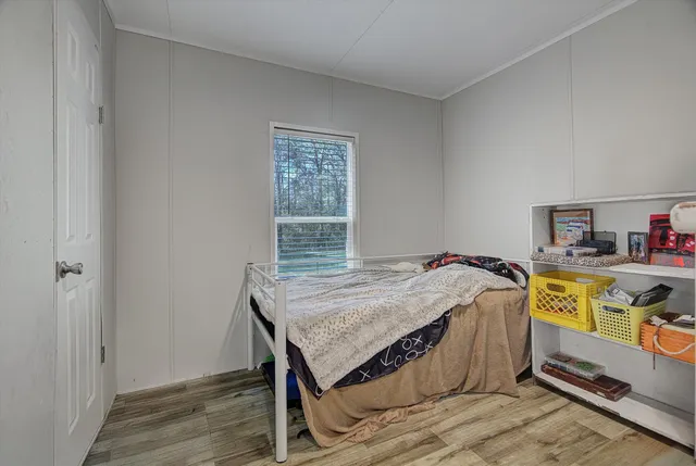 a bedroom with a bed and a table