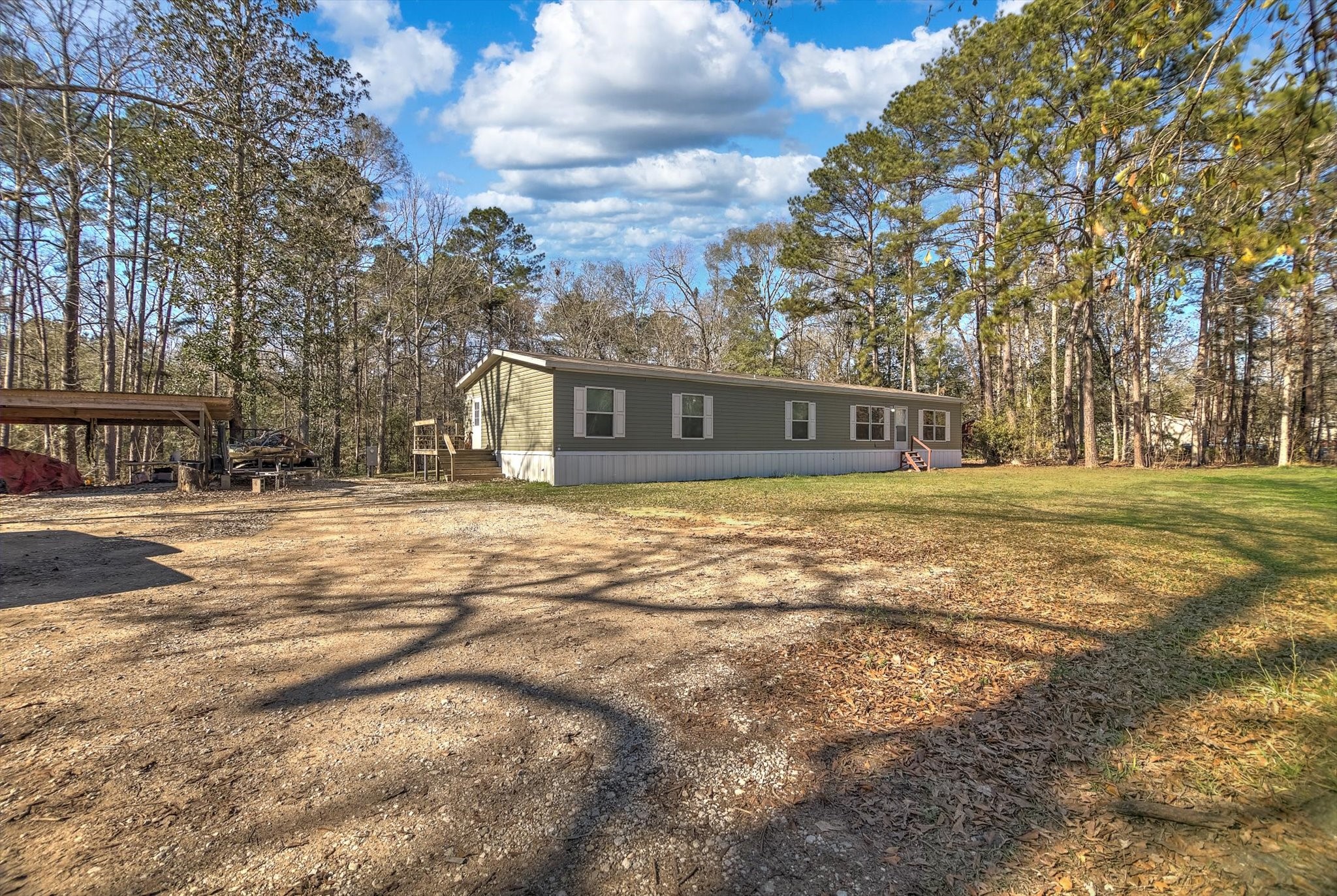 650 County Road 2219 Cleveland, TX 77327 - Photo 2 of 39 a view of a house with a yard