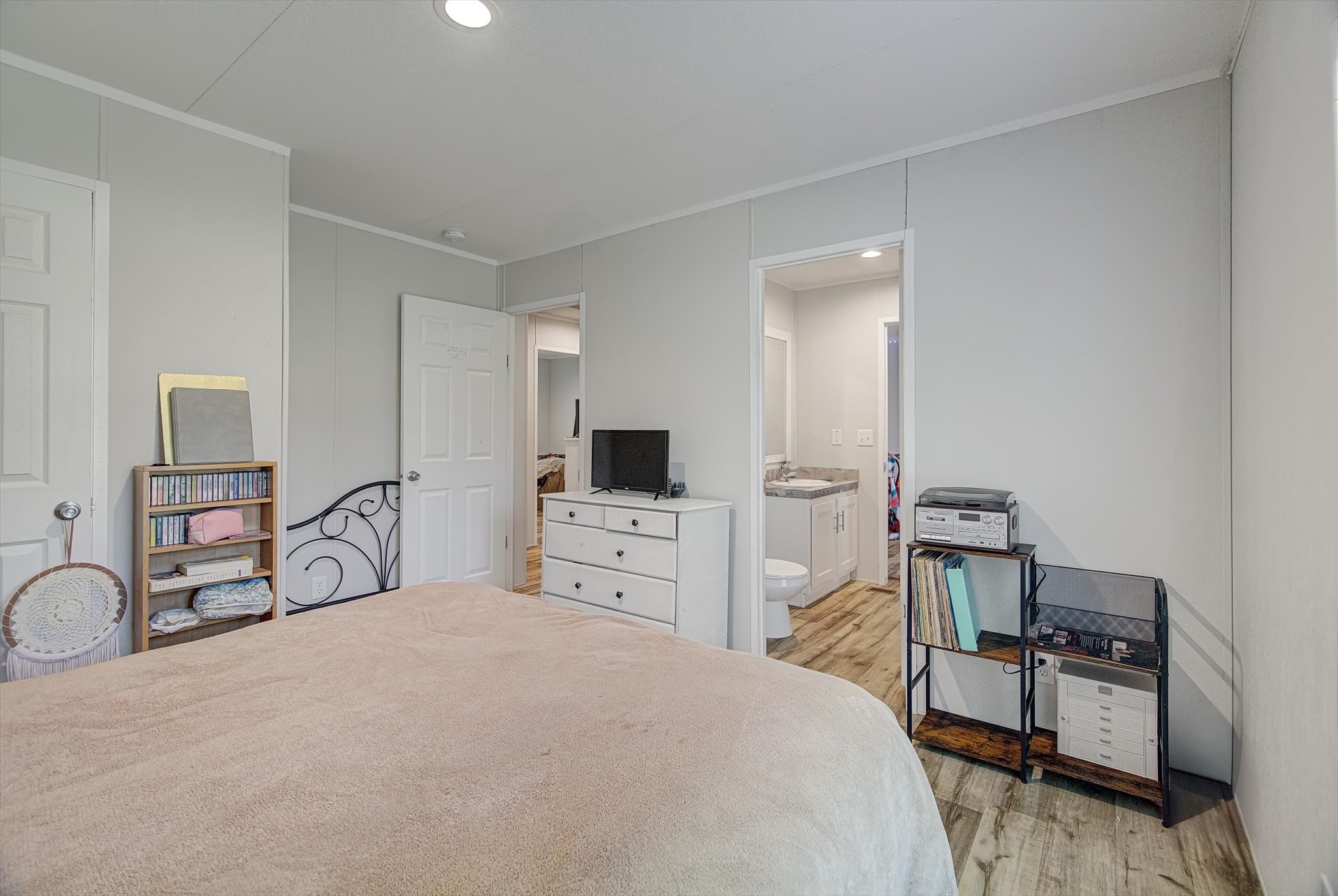 650 County Road 2219 Cleveland, TX 77327 - Photo 23 of 39 a bedroom with a bed and a flat screen tv