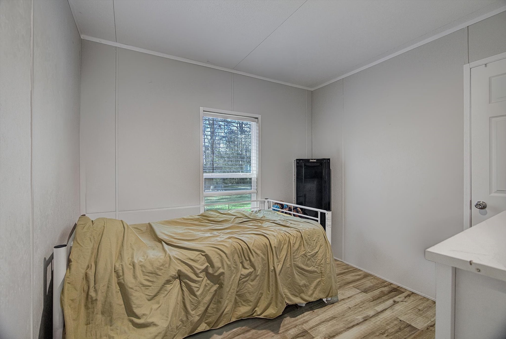 650 County Road 2219 Cleveland, TX 77327 - Photo 26 of 39 a bedroom with a bed and a window