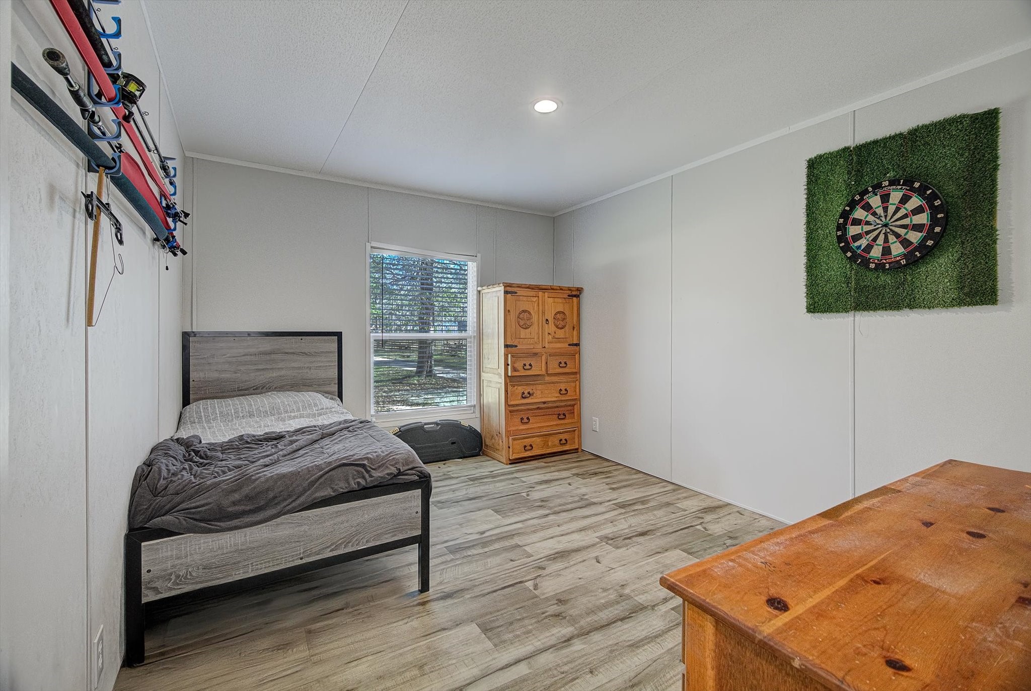 650 County Road 2219 Cleveland, TX 77327 - Photo 29 of 39 a bedroom with a bed and a window