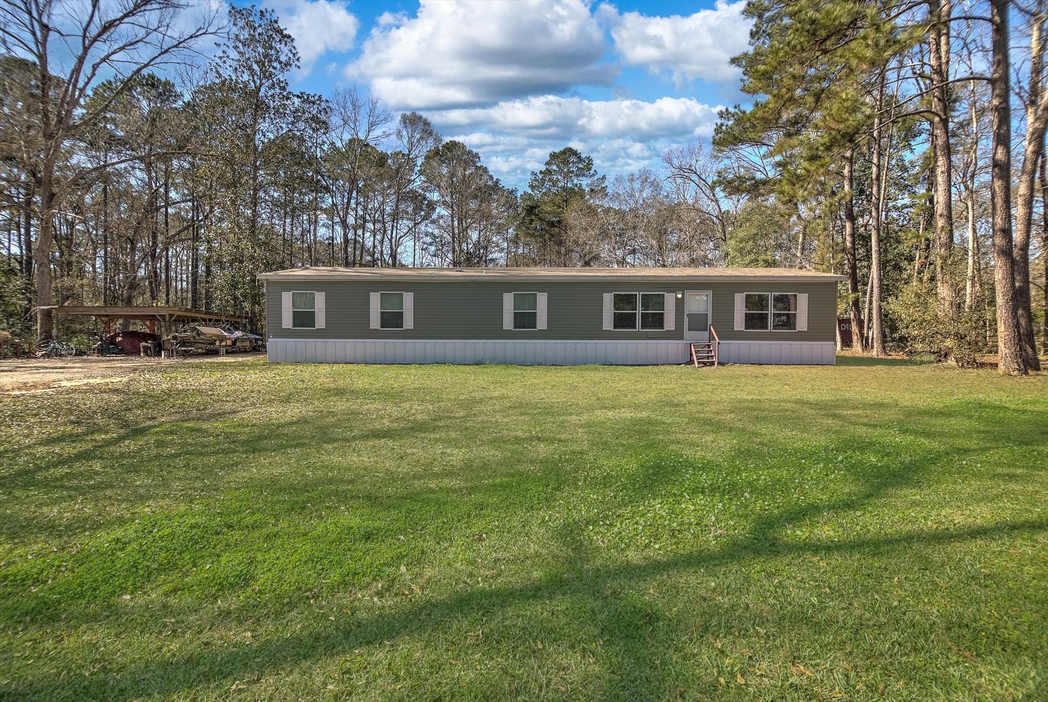 650 County Road 2219 Cleveland, TX 77327 - Photo 3 of 39 a view of a house with a yard
