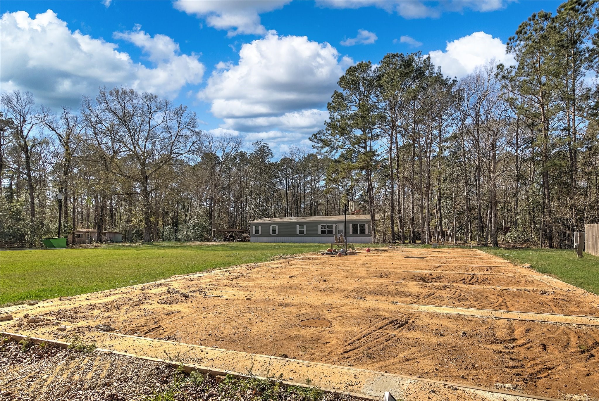 650 County Road 2219 Cleveland, TX 77327 - Photo 37 of 39 a view of white house with a yard