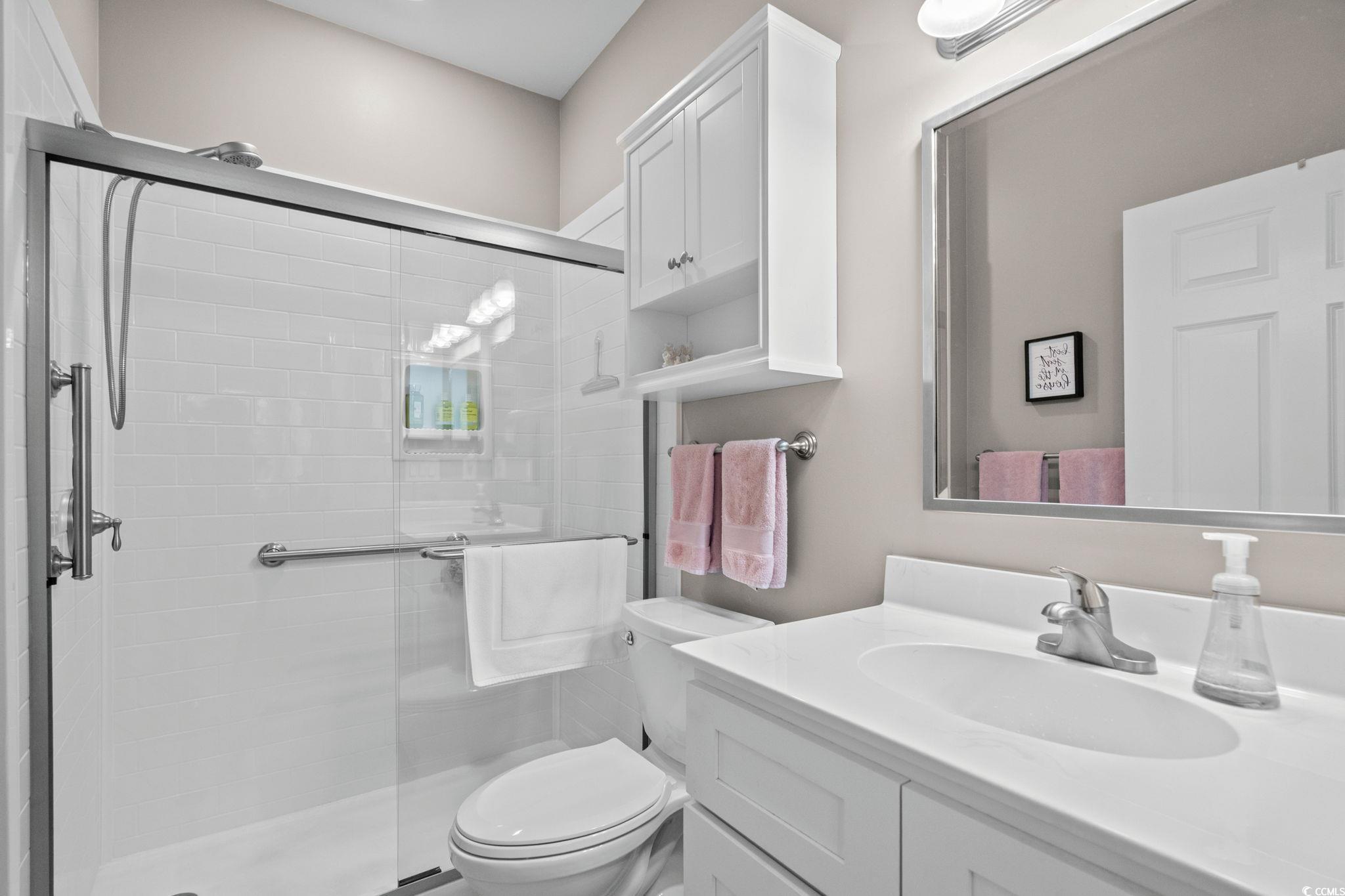 4885 Magnolia Pointe Lane, Unit 304 Myrtle Beach, SC 29577 - Photo 20 of 39 Full bath with vanity and a stall shower