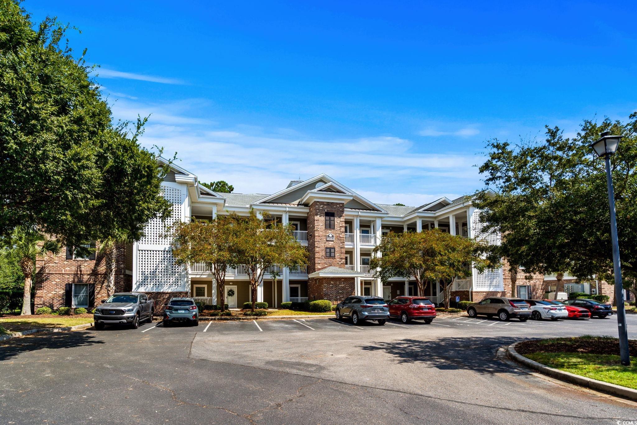 4885 Magnolia Pointe Lane, Unit 304 Myrtle Beach, SC 29577 - Photo 2 of 39 View of property with uncovered parking